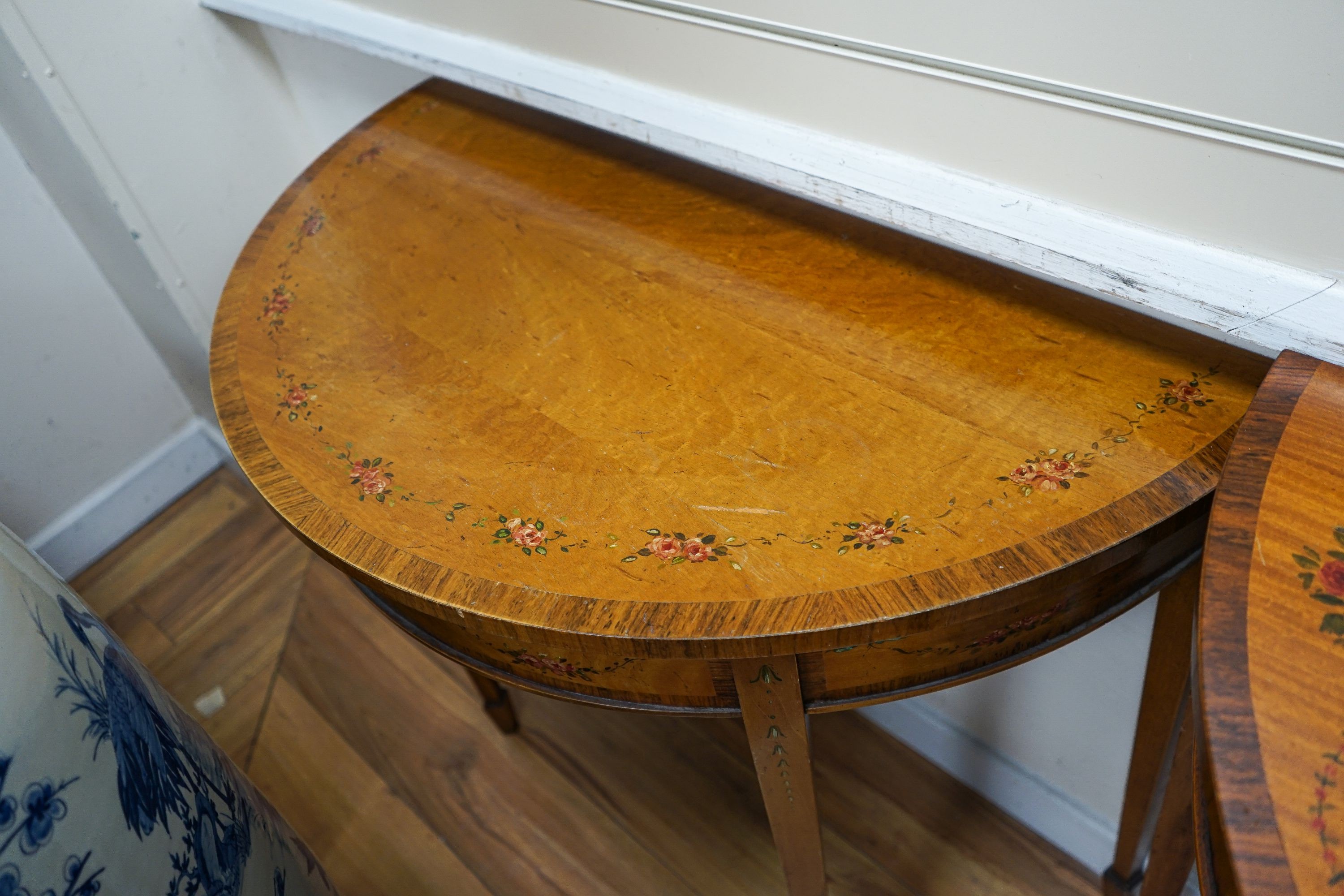 Three Sheraton style painted satinwood demi lune console tables, largest 92cm, width 46cm, height 82cm